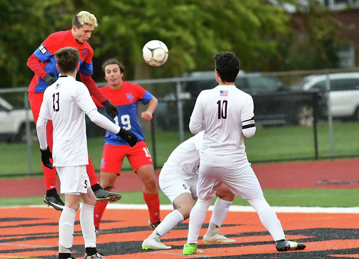 Maple Hill's Seth Roberts, left, heads a corner kicked ball into the net to score during the Class C boys' soccer semifinals against Stillwater at Mohonasen High School on Thursday, Oct. 25, 2018 in Schenectady, N.Y. (Lori Van Buren/Times Union)