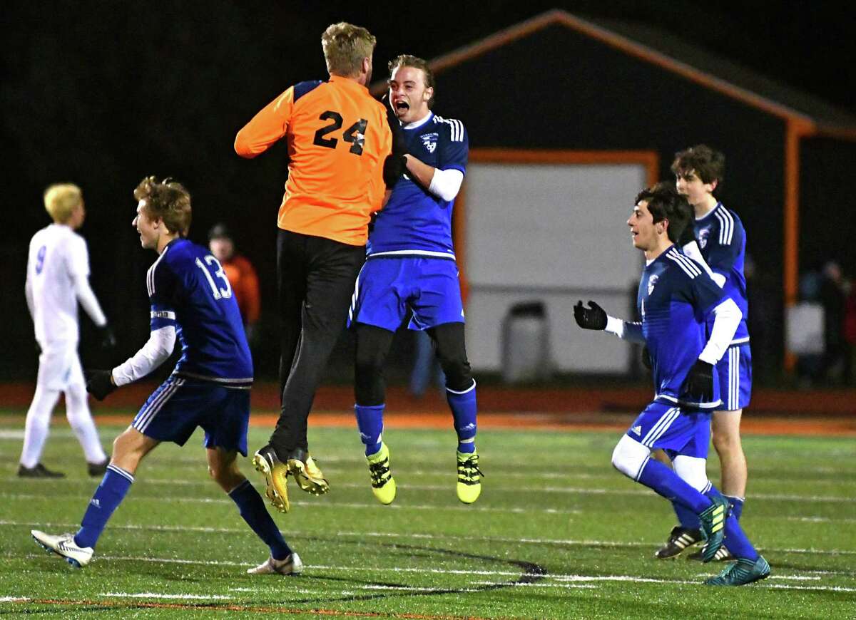 Lake George goalie Mason Flatley, #24, celebrates with Phillip Shambo who just scored in the first half during the Class C boys' soccer semifinals against Mayfield at Mohonasen High School on Thursday, Oct. 25, 2018 in Schenectady, N.Y. (Lori Van Buren/Times Union)