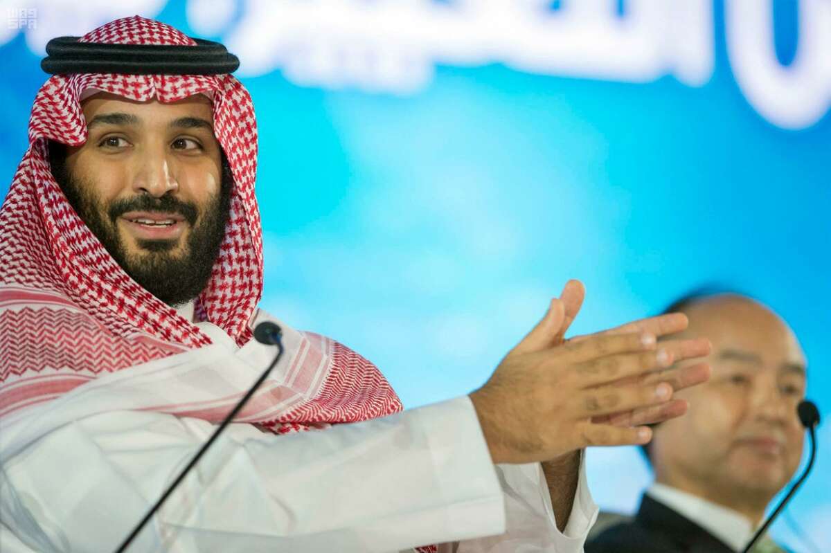FILE - In this Tuesday, Oct. 24, 2017, file photo released by the state-run Saudi Press Agency, Saudi Crown Prince Mohammed bin Salman speaks at the opening ceremony of Future Investment Initiative Conference in Riyadh, Saudi Arabia. Saudi Arabia's sovereign wealth fund invested over $1 billion on Monday, Sept. 17, 2018, in an American electric car manufacturer just weeks after Tesla CEO Elon Musk earlier claimed the kingdom would help his own firm go private. (Saudi Press Agency via AP, File)
