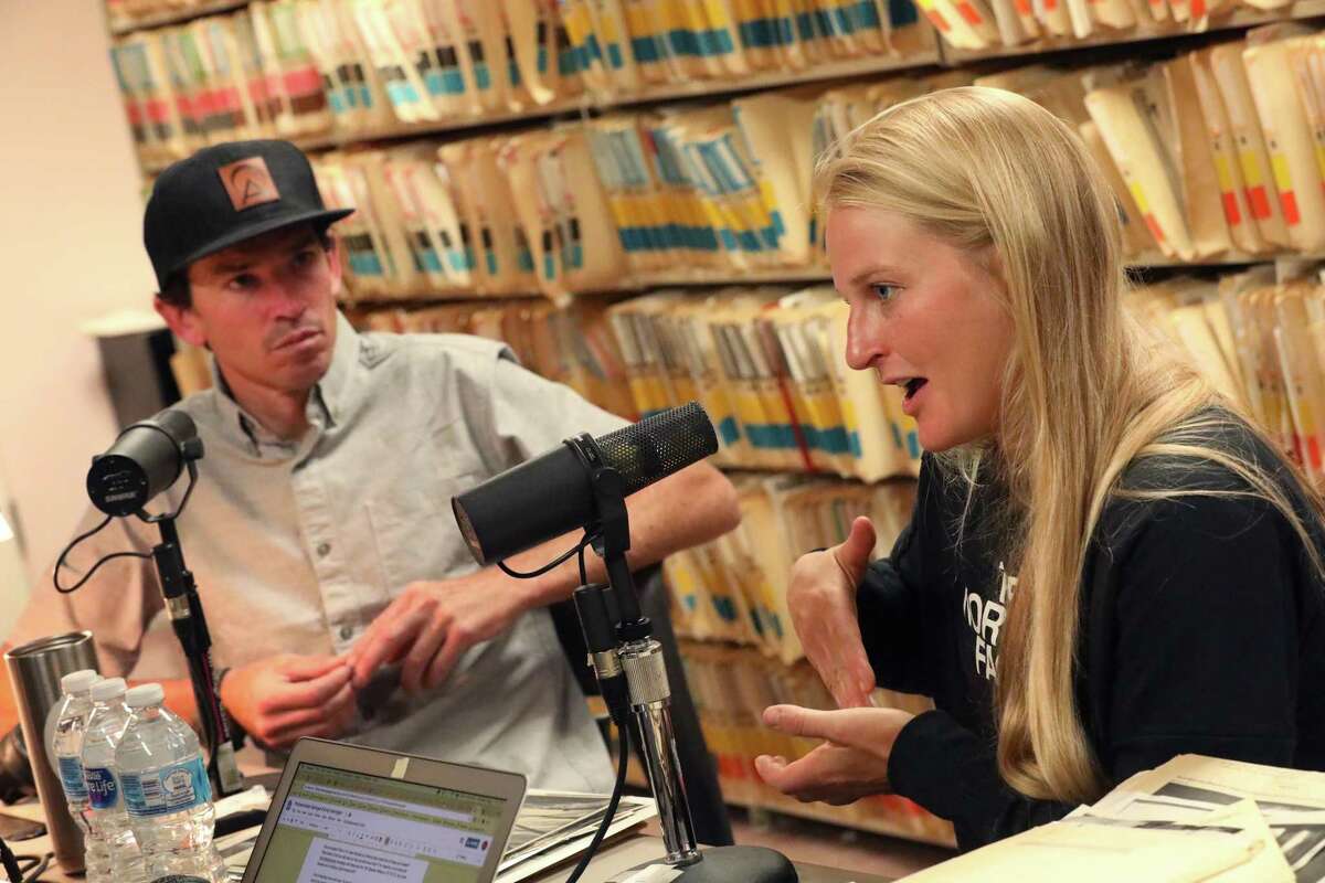 Everest mountain guide Adrian Ballinger (left) and pro rock climber Emily Harrington answer questions while recording a podcast at The Chronicle office in San Francisco.
