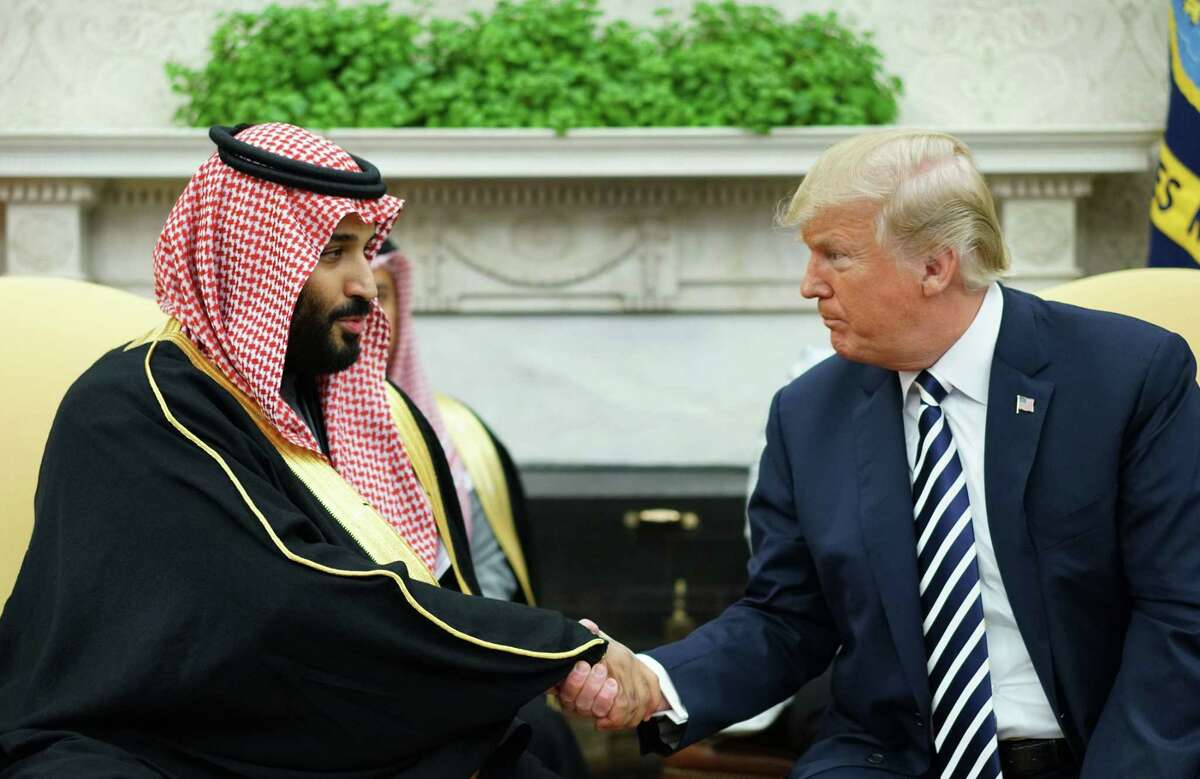 President Donald Trump shakes hands with Saudi Arabia's Crown Prince Mohammed bin Salman in the Oval Office on March 20. Readers ask for action from U.S. because of the death of U.S.-based journalist Jamal Khashoggi, allegedly at the behest of the crown prince.