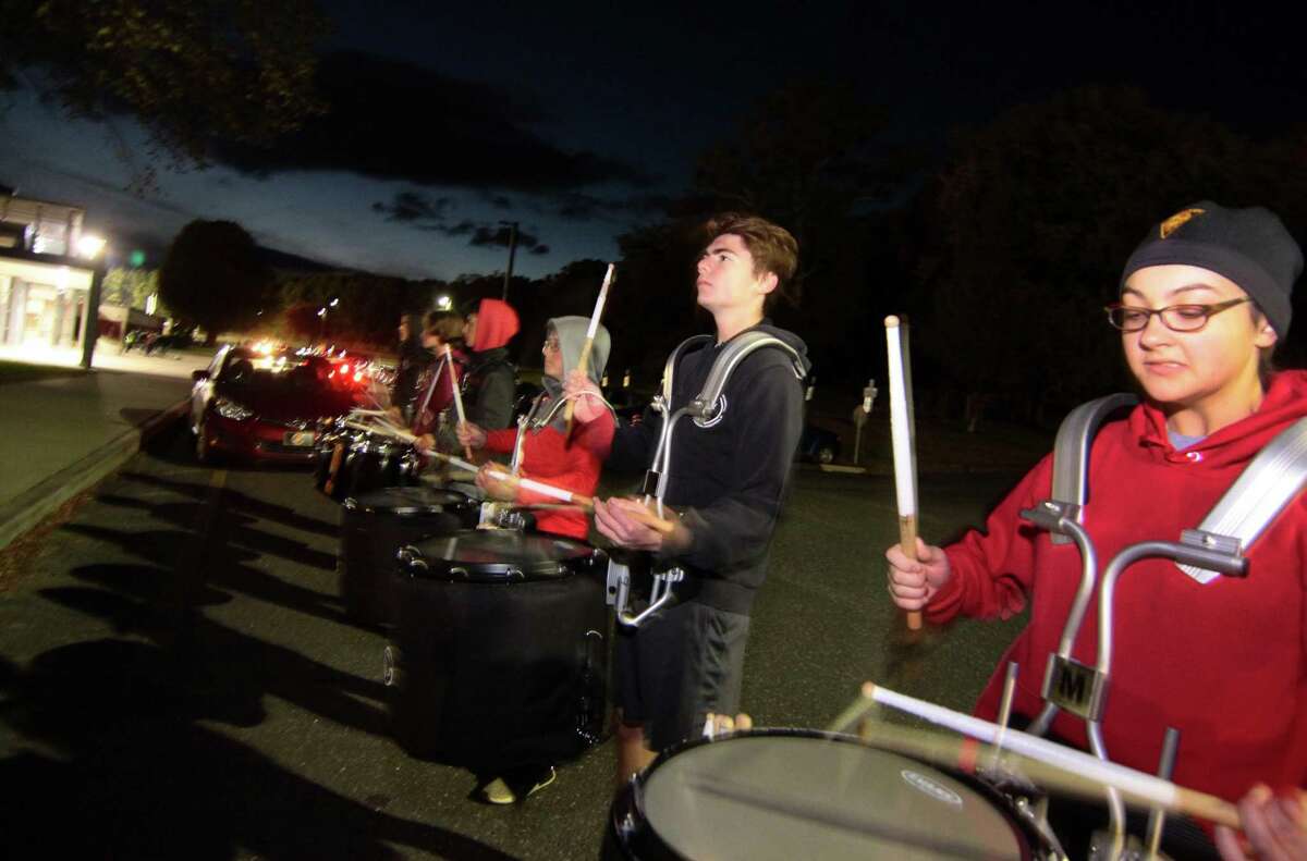 Members of the Trumbull High's "Golden Eagles" Marching Band practice at the school in Trumbull, Conn., on Thursday Oct. 25, 2018. They're facing three major championships coming up, the next one in New Britain on Saturday night.