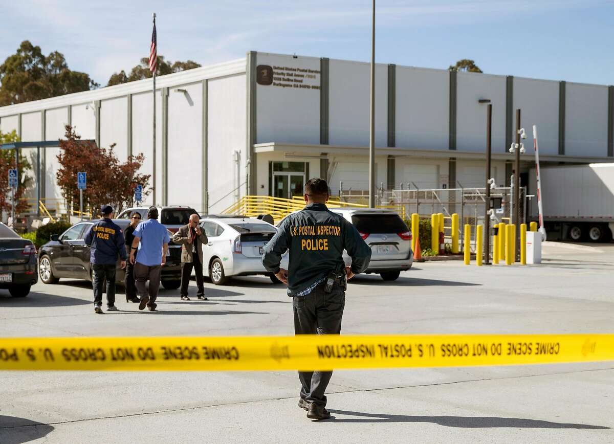 Emergency personnel monitor the scene after two suspicious packages addressed to Senator Kamala Harris and democratic activist and billionaire Tom Steyer at the U.S. Post Office at 1625 Rollins Road in Burlingame, Calif. Friday, Oct. 26, 2018.