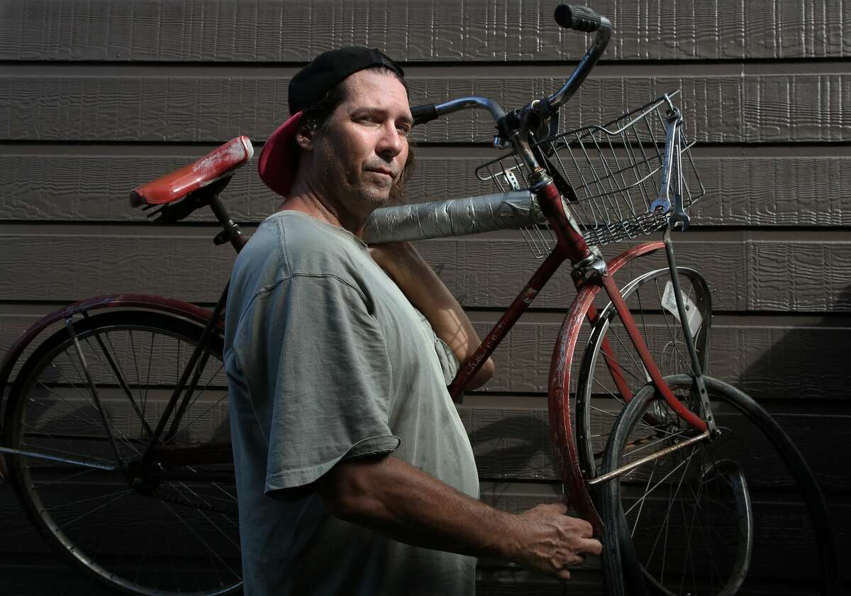 Tommy Wolfmeyer poses with the bicycle he was riding when he was struck by a motorist in Houston.