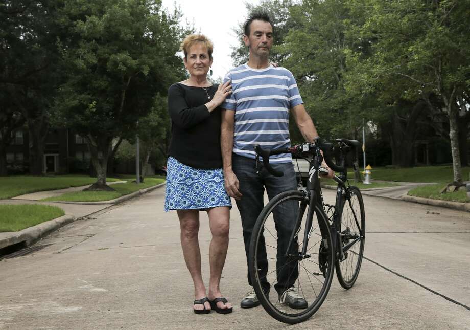 Joyce Baysinger and her husband, Doug, outside of their Sugar Land home. The two had major injuries after being hit by a drowsy driver while they were bicycle riding with a group in 2016. Photo: Elizabeth Conley/Staff Photographer