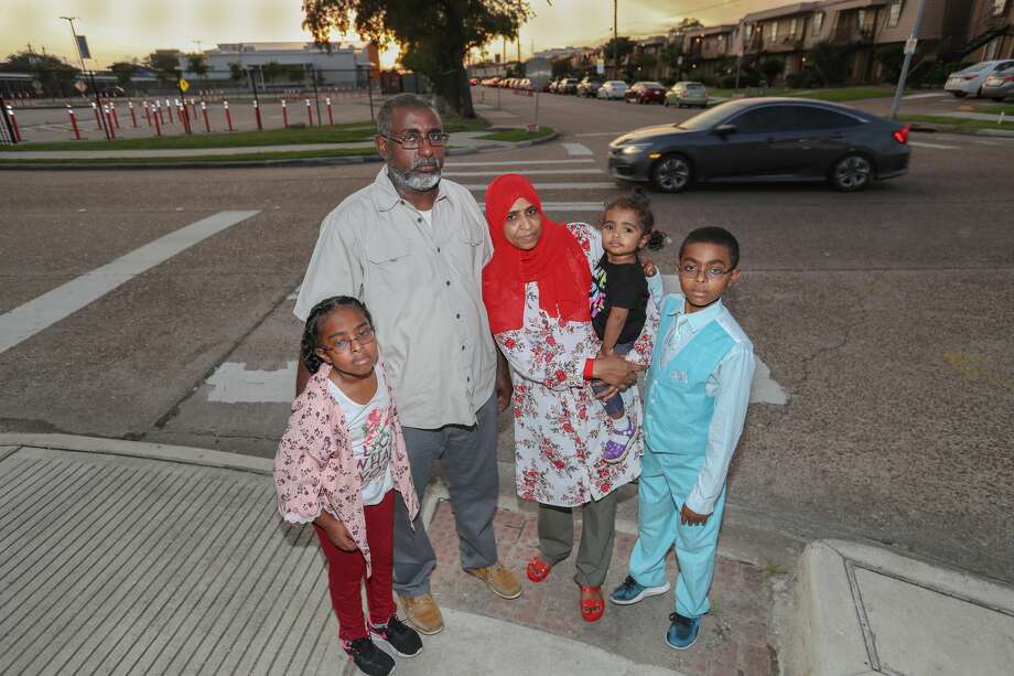 Rawan Ali Abdalla, 8, (l-r) Abohiada Ali Abdalla, Rahuf, 2, Wigdan Ahmed Mohammed and Osman Ali Abdalla, 12, stand at the crosswalk where their family member was killed two years ago in Houston. Mohammed Ali Abdalla, died 2 years ago after he was hit in a crosswalk. He was 4 years old. Photo: Steve Gonzales/Staff Photographer