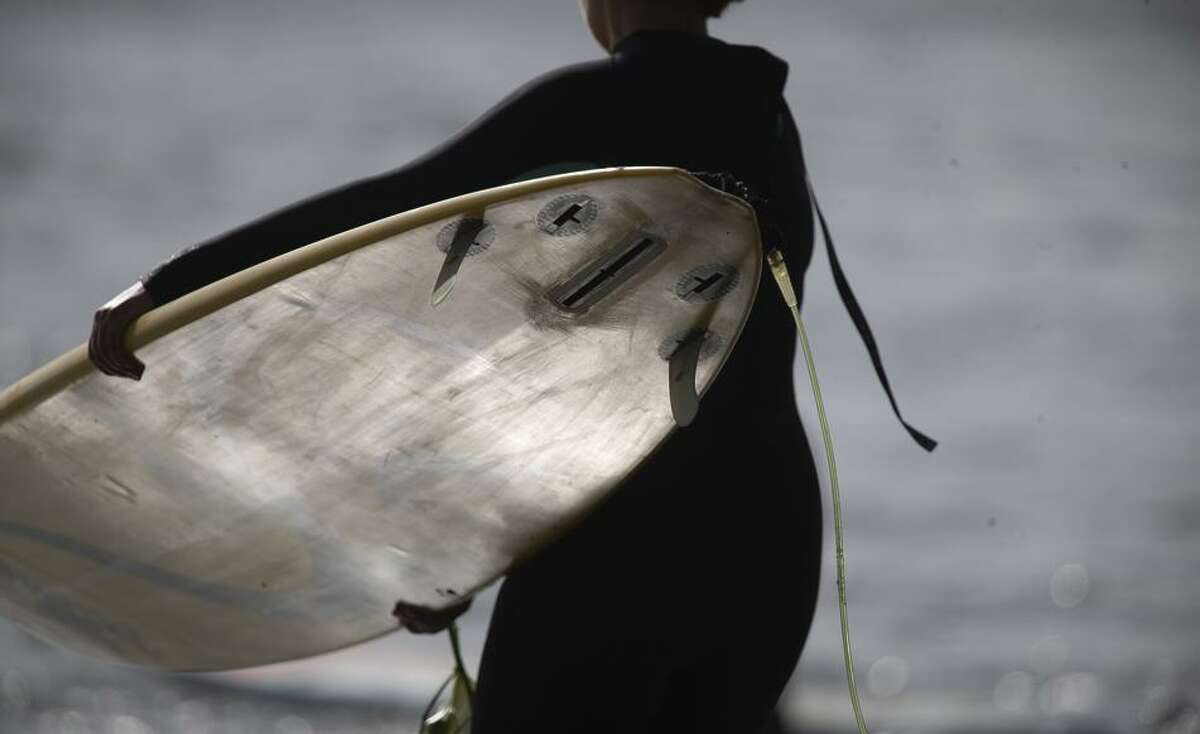 A surfer gets ready Friday, which featured the opening ceremony for the Mavericks big-wave surf contest in Half Moon Bay.