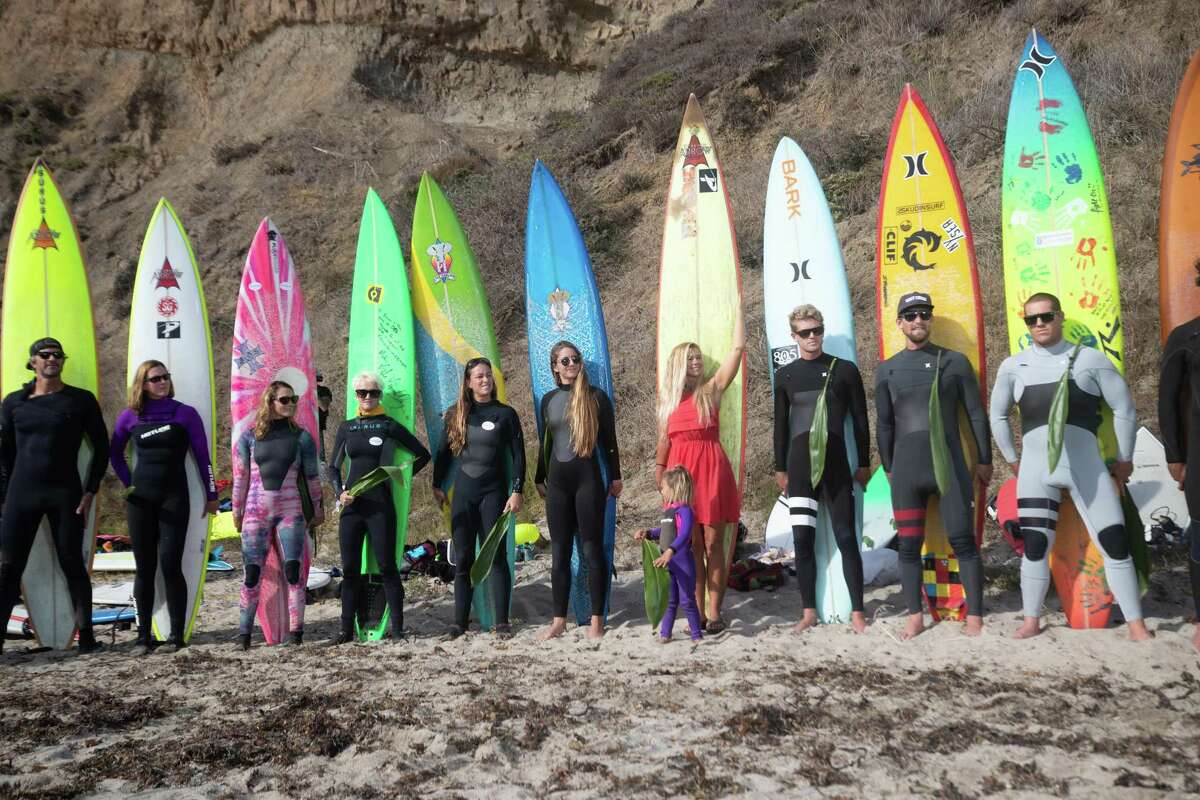 Surfers line up Friday at the opening ceremony for the Mavericks big-wave surf contest at Pillar Point in Half Moon Bay.