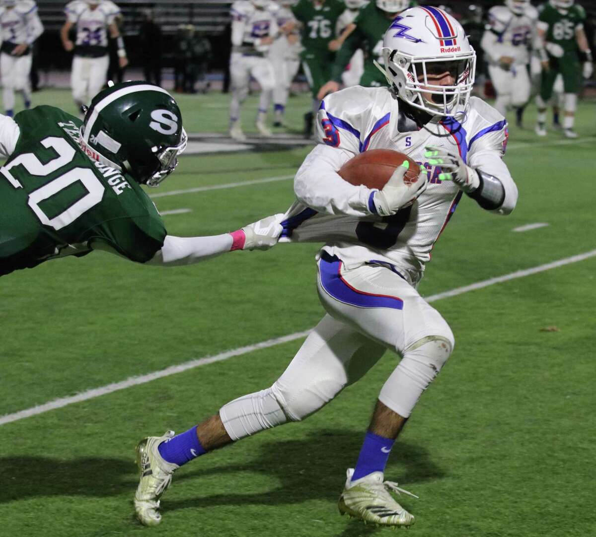 Tight grip by Shen's Dyvante Terrelonge eventually stops Saratoga's Christian Kondo during the Section II Class AA semifinal football matchup at Shenendehowa High School Friday, October 26, 2018. (Ed Burke photo-Special to The Times Union)