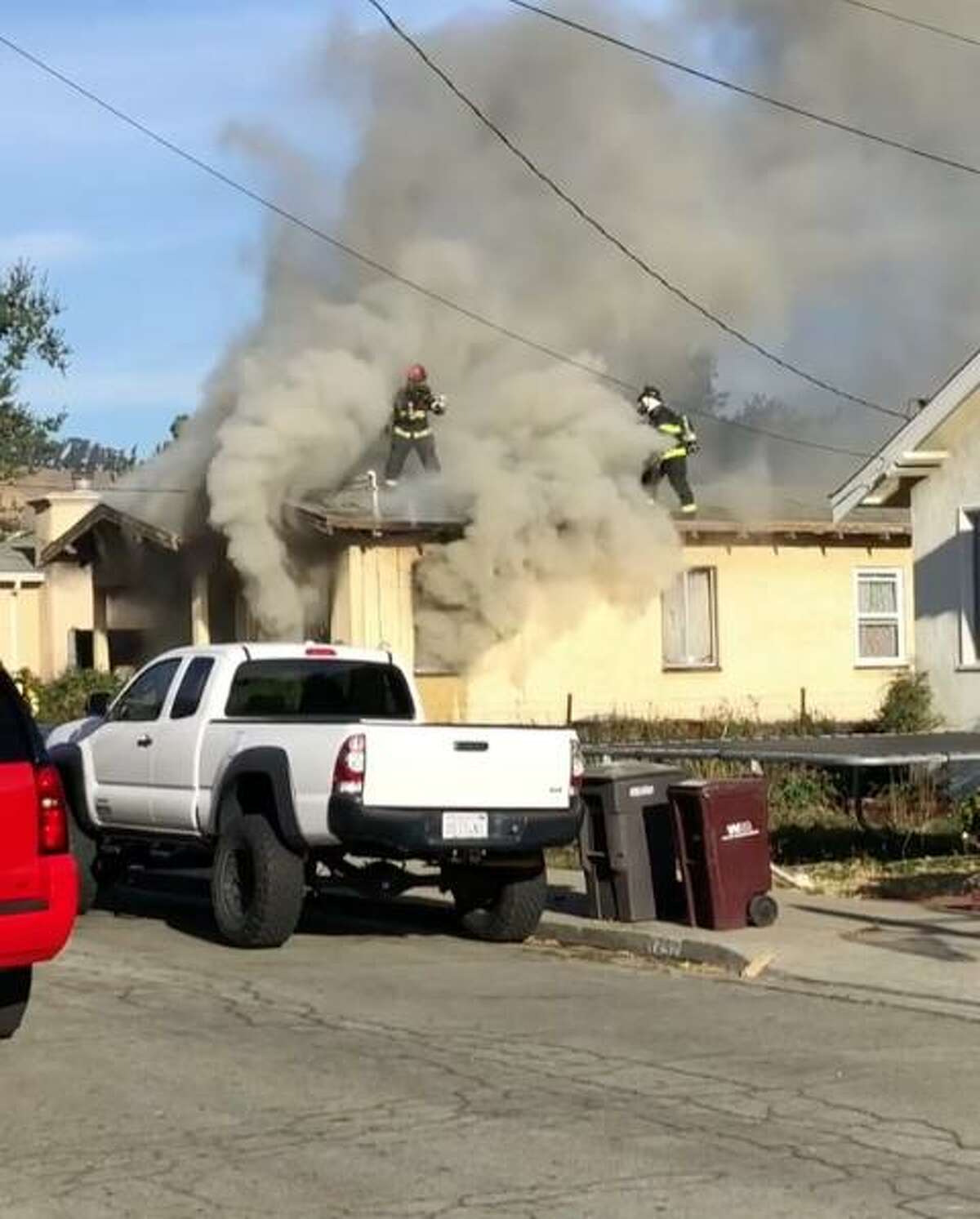 Alameda County firefighters pulled a man from a house fire Friday in San Leandro.