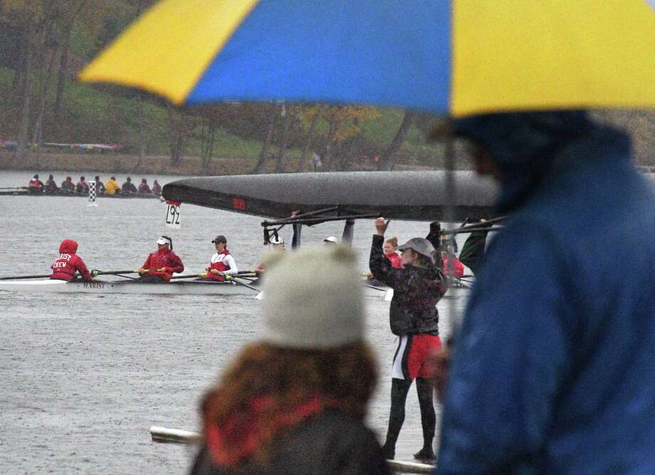 Dedicated fans watch races in a pouring rain during the annual Head of the Fish 2018 Head of the Fish regatta Saturday Oct. 27, 2018 in Saratoga Springs, NY.  (John Carl D'Annibale/Times Union) Photo: John Carl D'Annibale / 20045139A