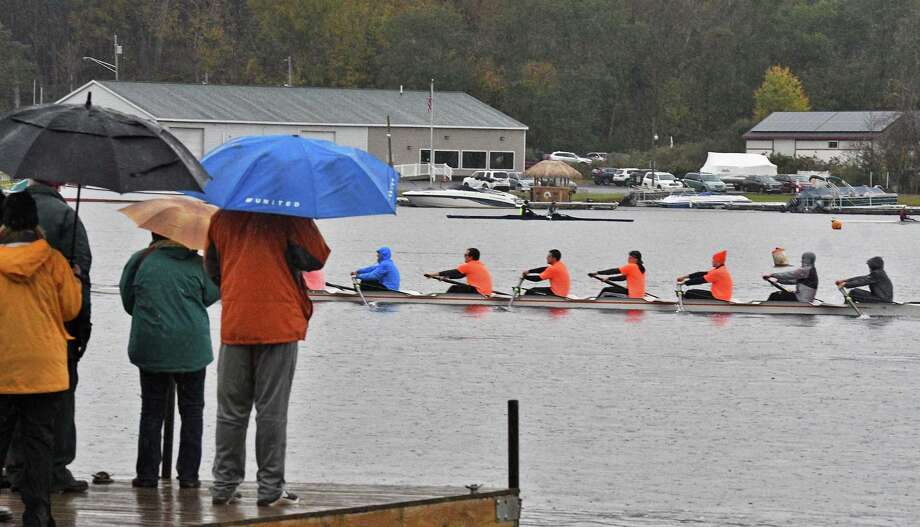 Dedicated fans watch a Men's Collegiate 8 race in a pouring rain during the annual Head of the Fish 2018 Head of the Fish regatta Saturday Oct. 27, 2018 in Saratoga Springs, NY.  (John Carl D'Annibale/Times Union) Photo: John Carl D'Annibale / 20045139A