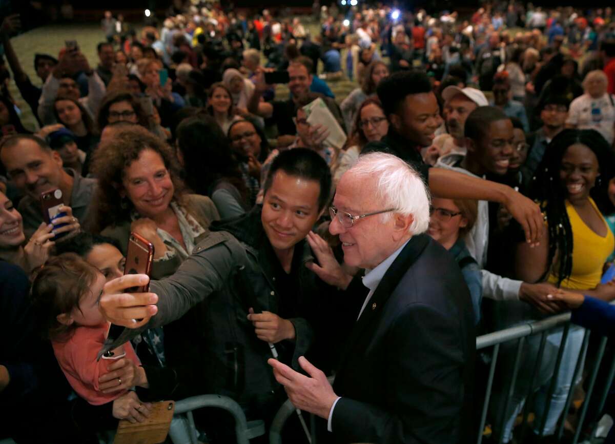 Vermont Sen. Bernie Sanders greets supporters after appearing at a campaign rally for Rep. Barbara Lee at the Berkeley Community Theater in Berkeley, Calif. on Saturday, Oct. 27, 2018.