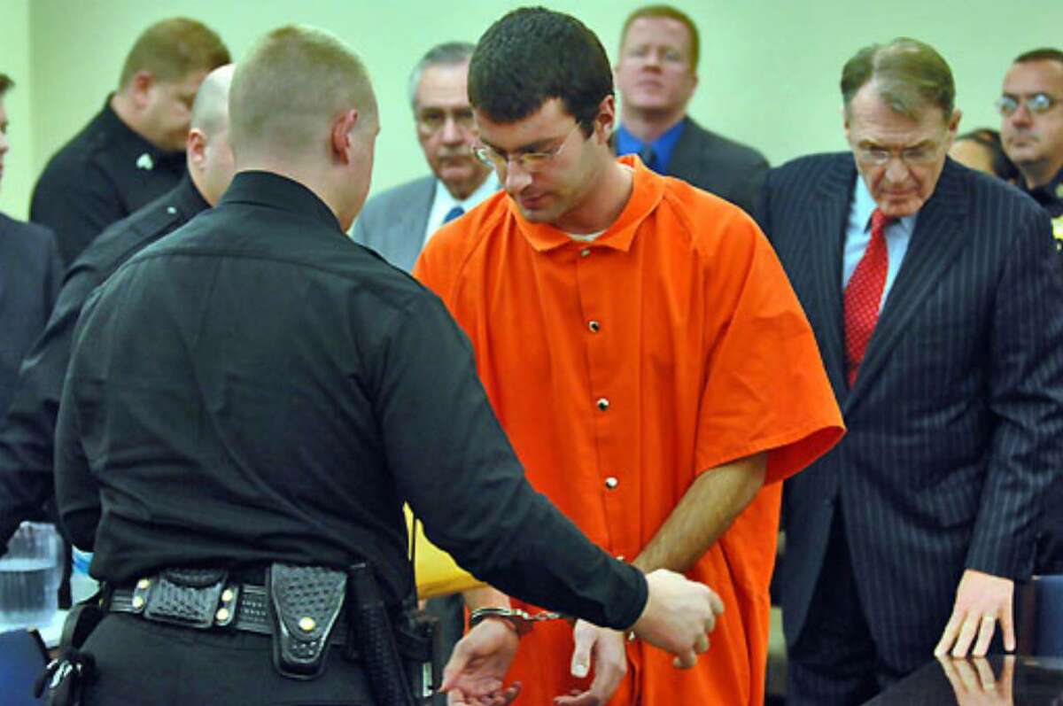 Albany County Sheriff's deputies handcuff Christopher Porco before his sentencing at the Albany County Courthouse today.