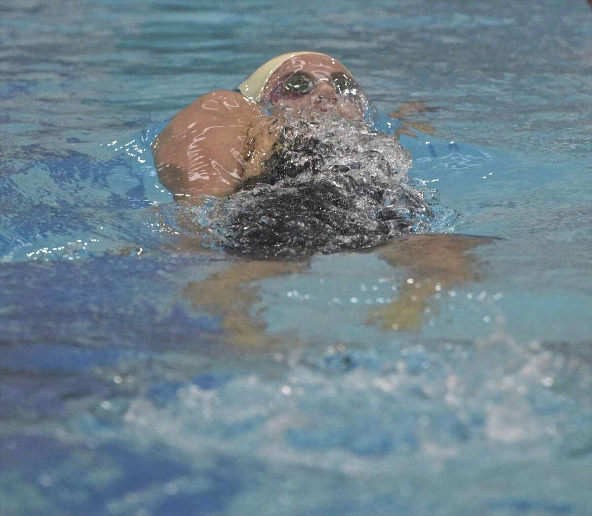 Weston’s Bella Gary swims the backstroke in the 200 yard individual medley at the girls SWC championships Saturday.
