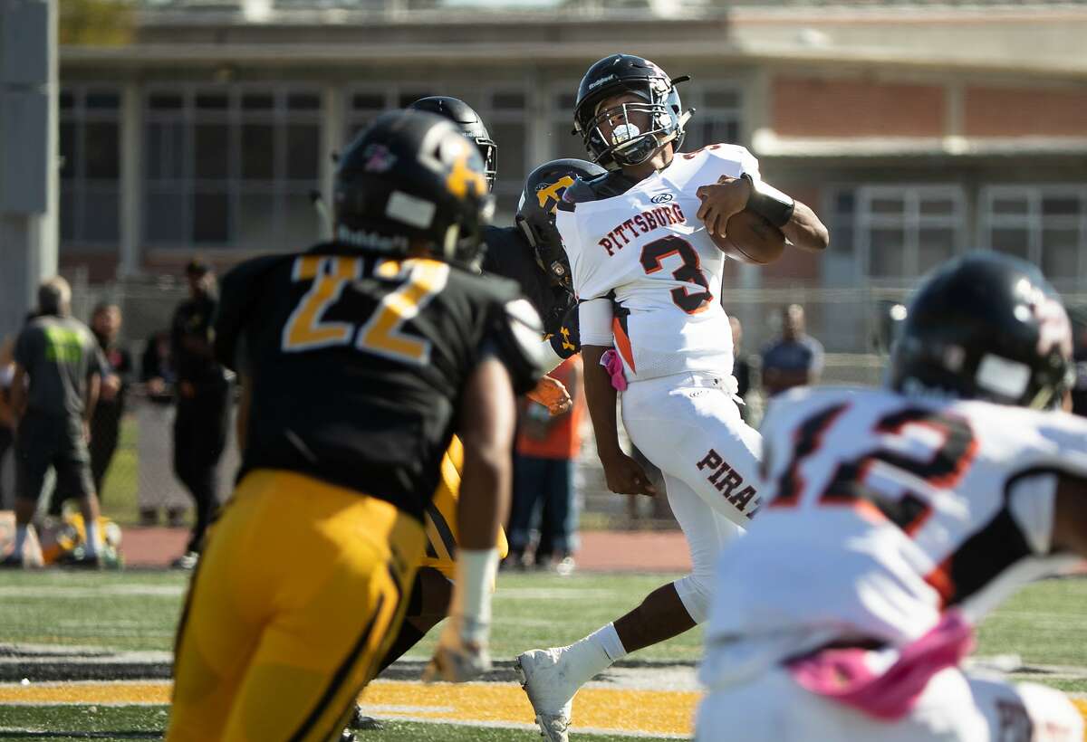 Pittsburg's Willie Harts III is pulled back by Dejuan Butler of Antioch in the first half on Saturday, Oct. 27, 2018, in Antioch, Calif.