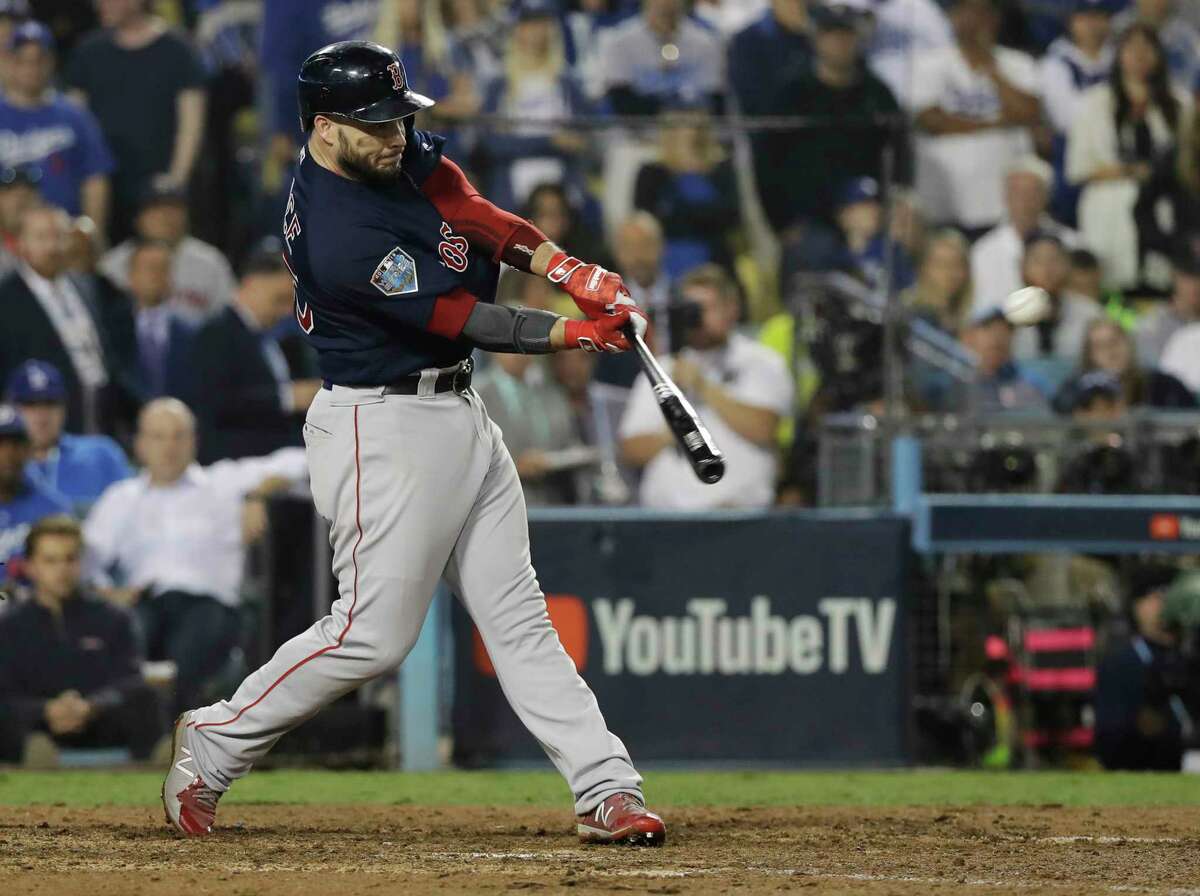 Boston Red Sox's Steve Pearce hits a three-run RBI double during the ninth inning in Game 4 of the World Series baseball game against the Los Angeles Dodgers on Saturday, Oct. 27, 2018, in Los Angeles. (AP Photo/David J. Phillip)