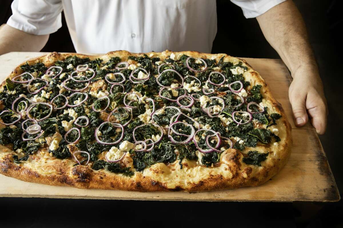 Vinny’s1201 Saint Emanuel Fast-casual pizza joint, Vinny's, slings pies in multiple styles from lunch until late night. The Green Machine (pictured) is topped with curry kale, feta, Parmesan and three type of onion: red, caramelized and sweet. 