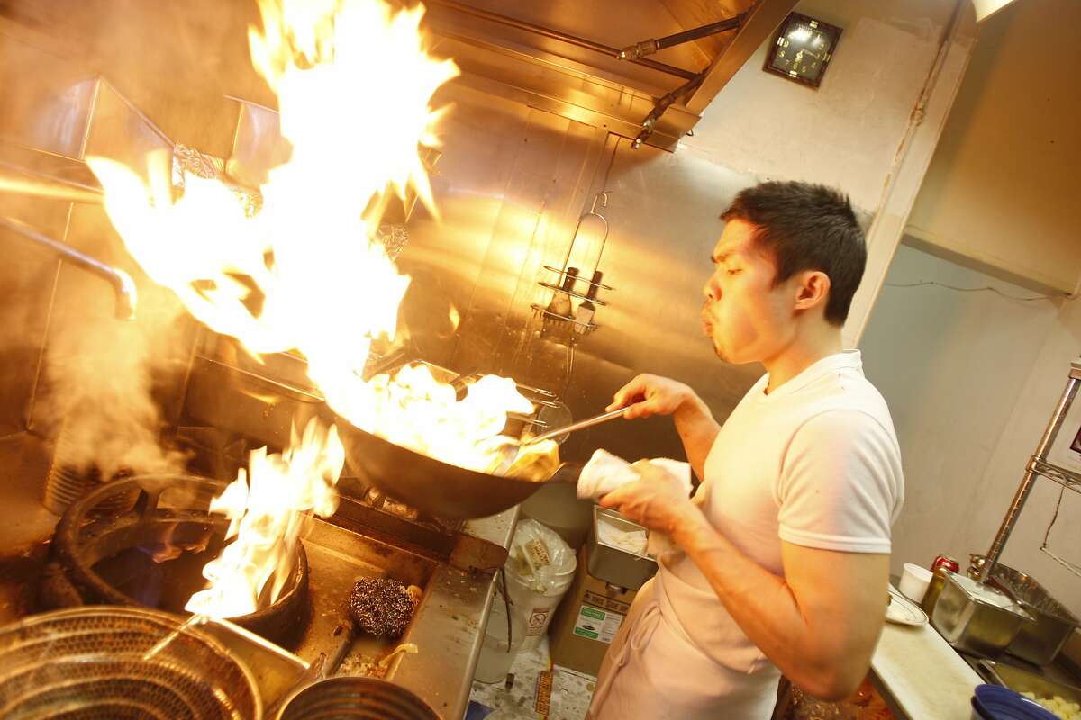 Co-founder Anthony Myint takes over half the kitchen while cooking at Mission Street Food which converts at night in the Lung Shan Restaurant in the Mission District of San Francisco photographed on Thursday, February 12, 2009.