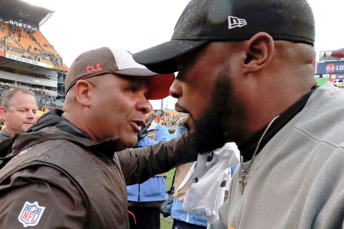 Pittsburgh Steelers head coach Mike Tomlin, right, greets Cleveland Browns head coach Hue Jackson after an NFL football game against the Cleveland Browns, Sunday, Oct. 28, 2018, in Pittsburgh. The Steelers won 33-18.