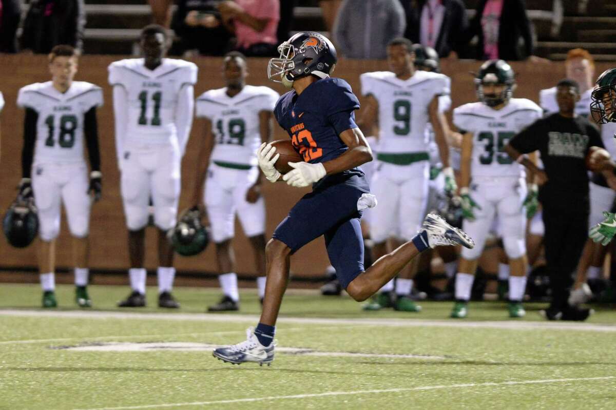 Eric Johnson (82) of Seven Lakes scores on an 82 yard run in the first quarter of a high school football game between the Seven Lakes Spartans and the Mayde Creek Rams on Friday, October 26, 2018 at Rhodes Stadium, Katy, TX.