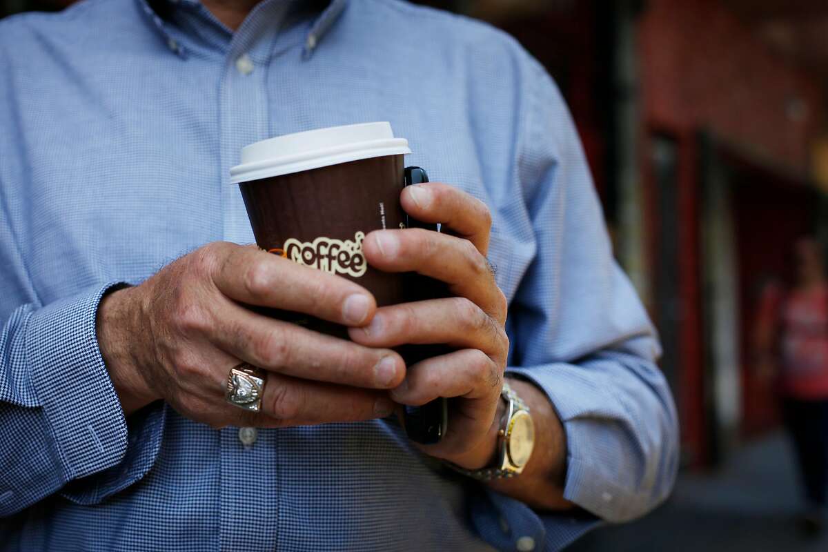 Founder and owner of Philz Coffee Phil Jaber holds his own cup of coffee at the corner of 24th and Folsom Streets on June 4, 2014 in San Francisco, Calif