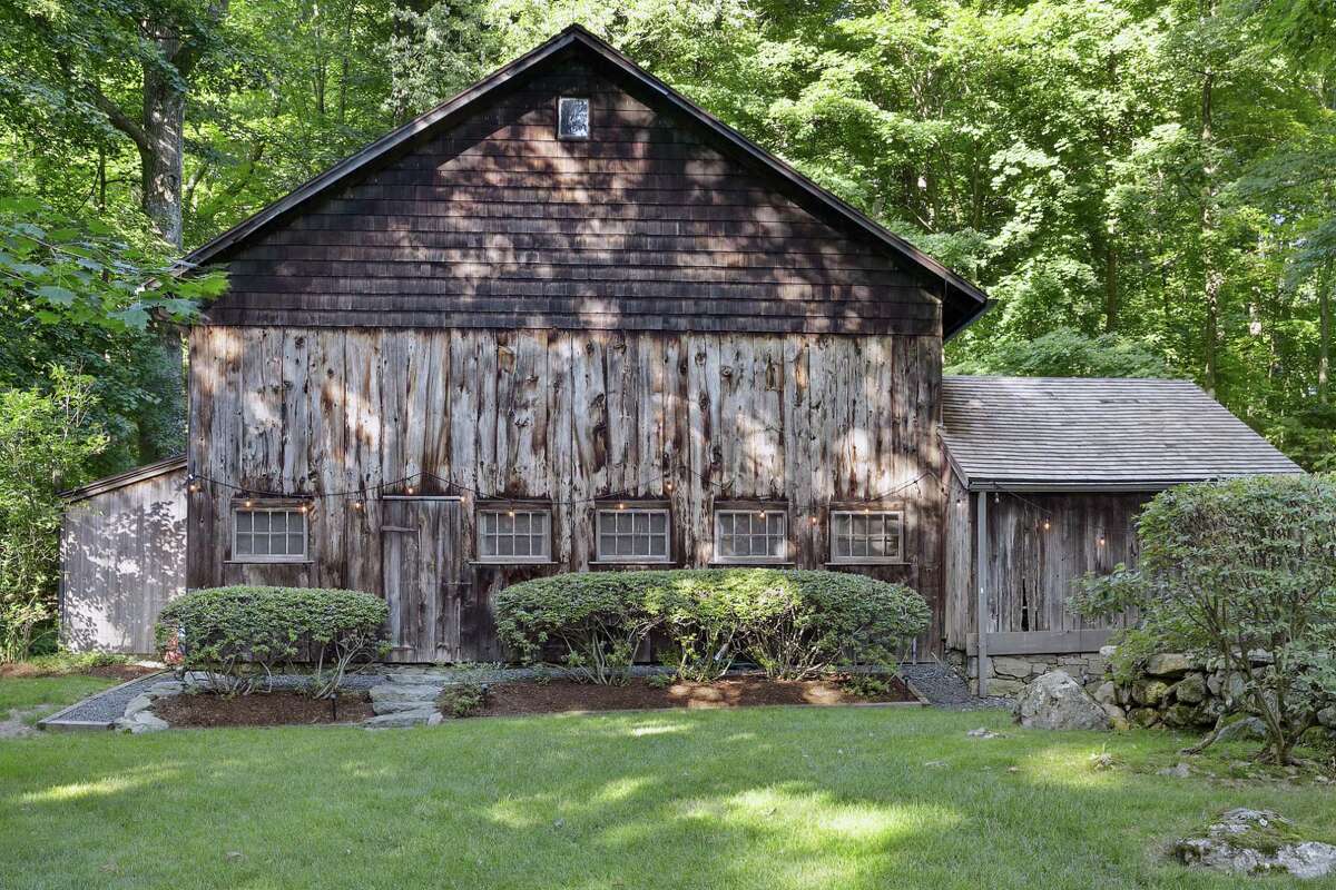 The two-story barn is from the 1800s and doubles as a three-car garage. It also has a craft room or hobby shop.