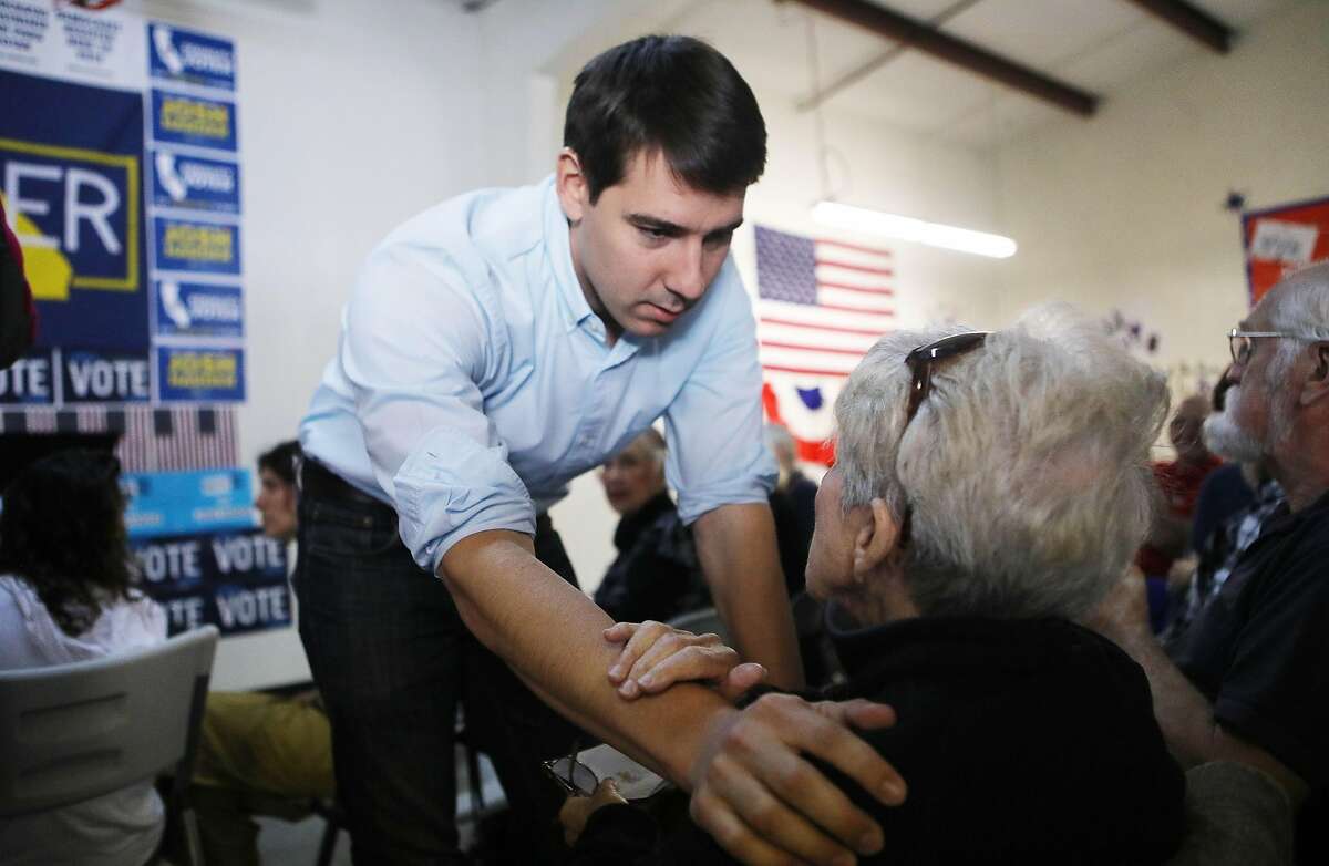 Democratic congressional candidate Josh Harder speaks to a supporter at a campaign rally in support of Social Security and Medicare on October 24, 2018 in Modesto, California. Harder is running for the seat held by incumbent U.S. Rep. Jeff Denham (R-CA). Democrats are targeting seven congressional seats in California, currently held by Republicans, where Hillary Clinton received more votes in the 2016 presidential election. These districts have become the centerpiece of their strategy to flip the House and represent nearly one-third of the 23 seats needed for the Democrats to take control of the chamber in the November 6 midterm elections. (Photo by Mario Tama/Getty Images)