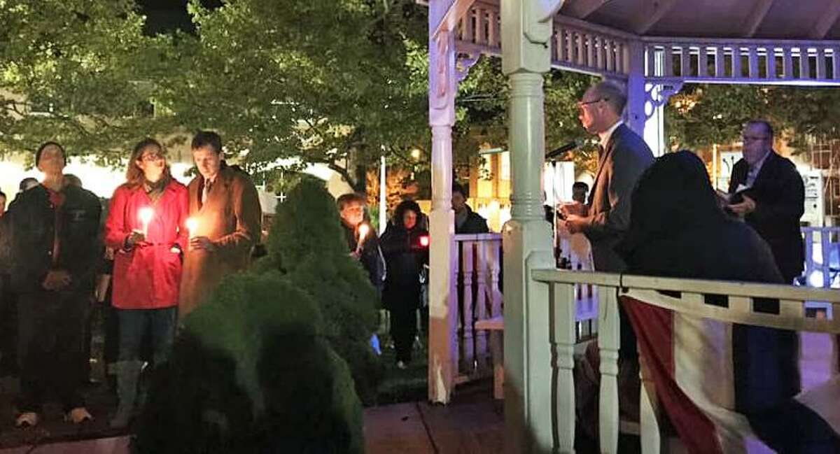 A couple hundred individuals of all faiths turned out Sunday night at Middletown’s South Green to honor the 11 people killed during Saturday’s shooting at the Tree of Life Synagogue in the Squirrel Hill section Pittsburgh, Pennsylvania. Six others were injured. Middletown resident, Attorney Sarah Steinfeld, in red, wife of state Rep. Matthew Lesser, D-Middletown, to her right, grew up in the neighborhood.