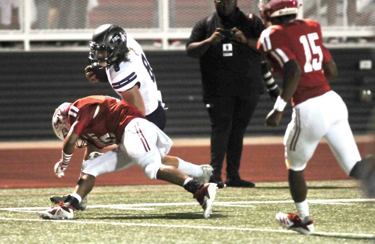 Port Neches-Groves wise receiver Cooper Hammond is brought down near the end zone during a first quarter drive in the Indians?’ game Friday night at Crosby. (Mike Tobias/The Enterprise)