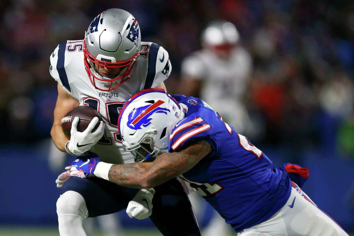 New England Patriots wide receiver Chris Hogan, left, is hit by Buffalo Bills cornerback Tre'Davious White during the first half of an NFL football game, Monday, Oct. 29, 2018, in Orchard Park, N.Y. (AP Photo/Jeffrey T. Barnes)