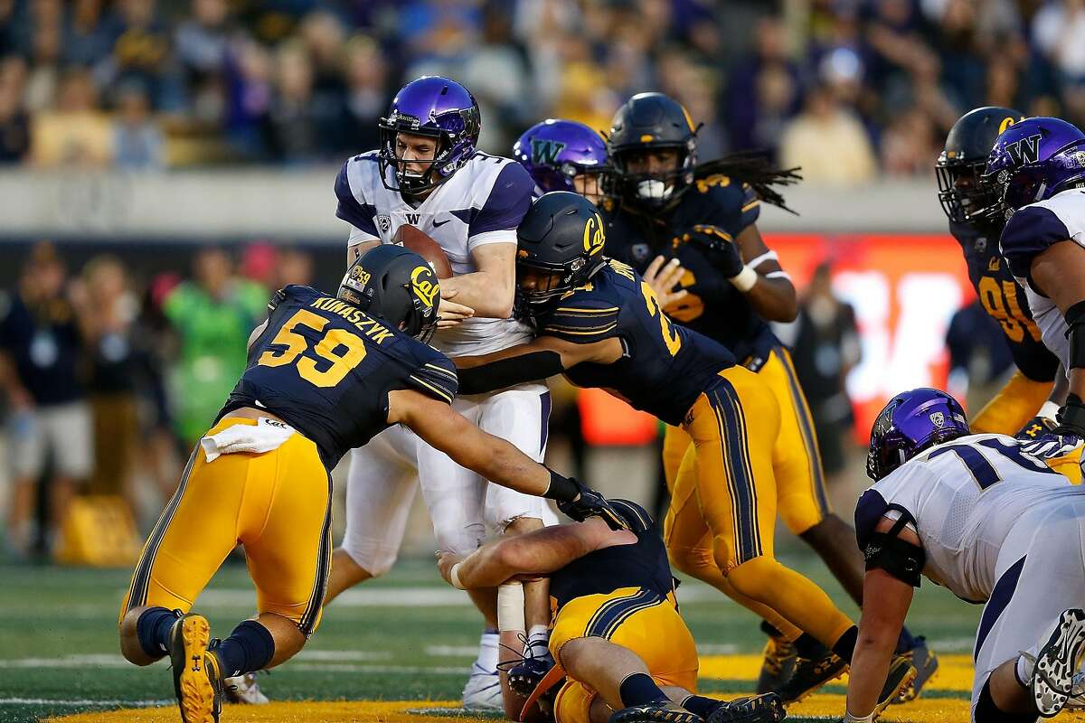 BERKELEY, CA - OCTOBER 27: Quarterback Jake Browning #3 of the Washington Huskies is tackled by Camryn Bynum #24 of the California Golden Bears at California Memorial Stadium on October 27, 2018 in Berkeley, California. (Photo by Lachlan Cunningham/Getty Images)