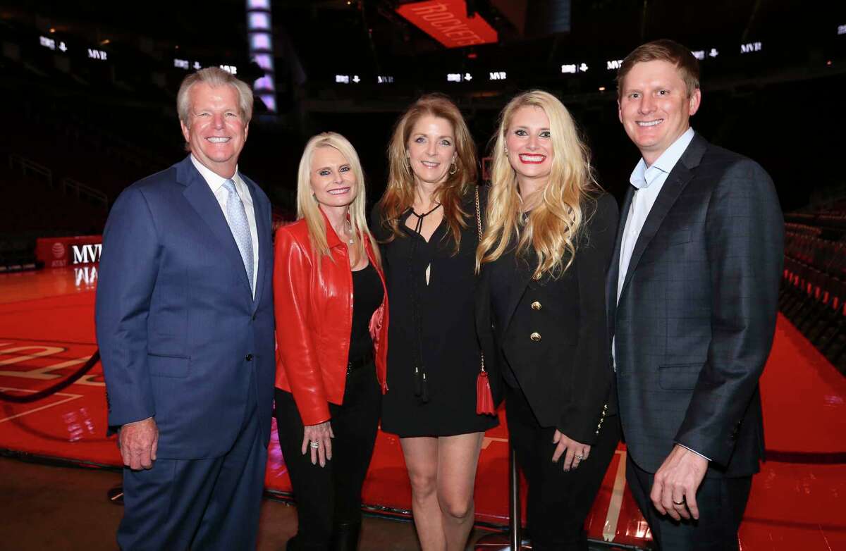 Paige Fertitta, center, Jo Lynn and Gregg Falgout, left, and Christine Falgout-Gutknecht and Bill Gutknecht pose for a photograph at the Lexus Lounge before the MVPs courtside dinner, hosted by Houston Rockets and Children's Memorial Hermann, at Toyota Center on Thursday, Oct. 25, 2018, in Houston.