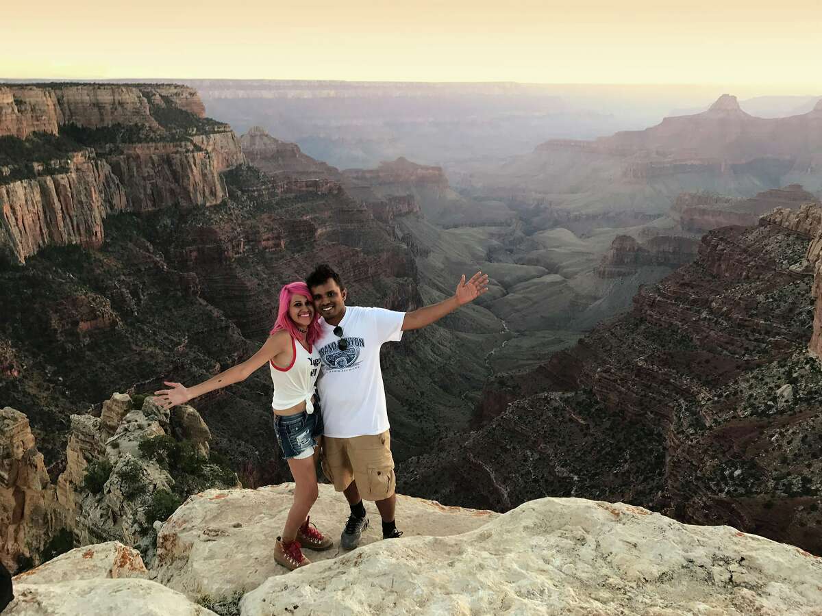 Vishnu Viswanath, 29, and his wife, Meenakshi Moorthy, 30, loved "daredevilry" in the great outdoors. The Indian couple were killed last week in an 800-foot fall from Yosemite's Taft Point overlook. Here they are shown on a ledge on the North Rim of the Grand Canyon.
