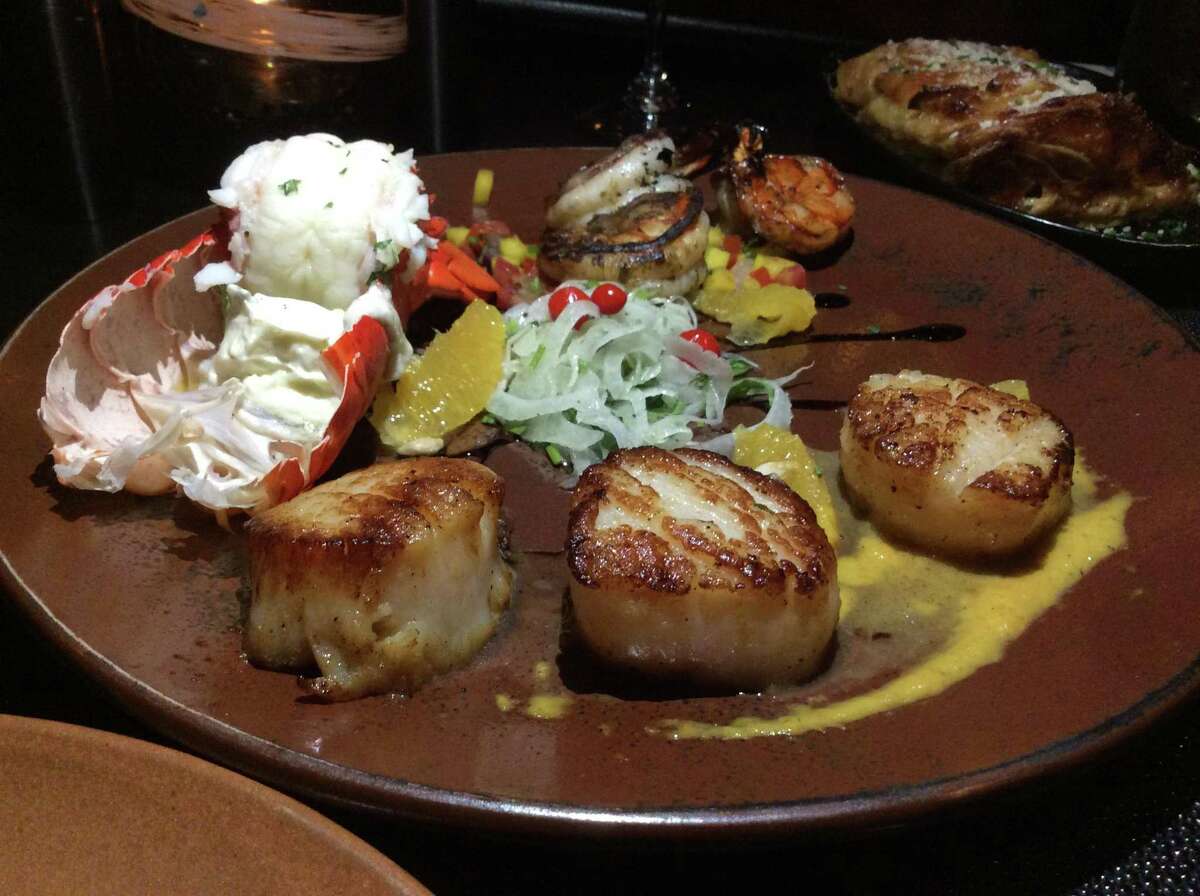 The Seafood Lovers Trio (cold water lobster tail, Hokkaido seared sea scallops and jumbo grilled tiger shrimp) Served at Mariposa Latin Inspired Grill.