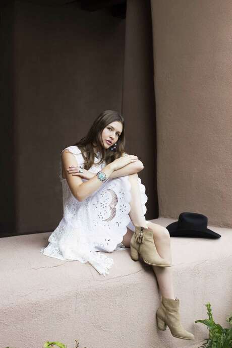 Sofia Resnik-Cornet wears a winter white lace tunic, $995, and short circle skirt, $980, from Martha Medeiros. Suede Zephyr booties, $535, Stuart Weitzman. 
 Location: Hotel Santa Fe