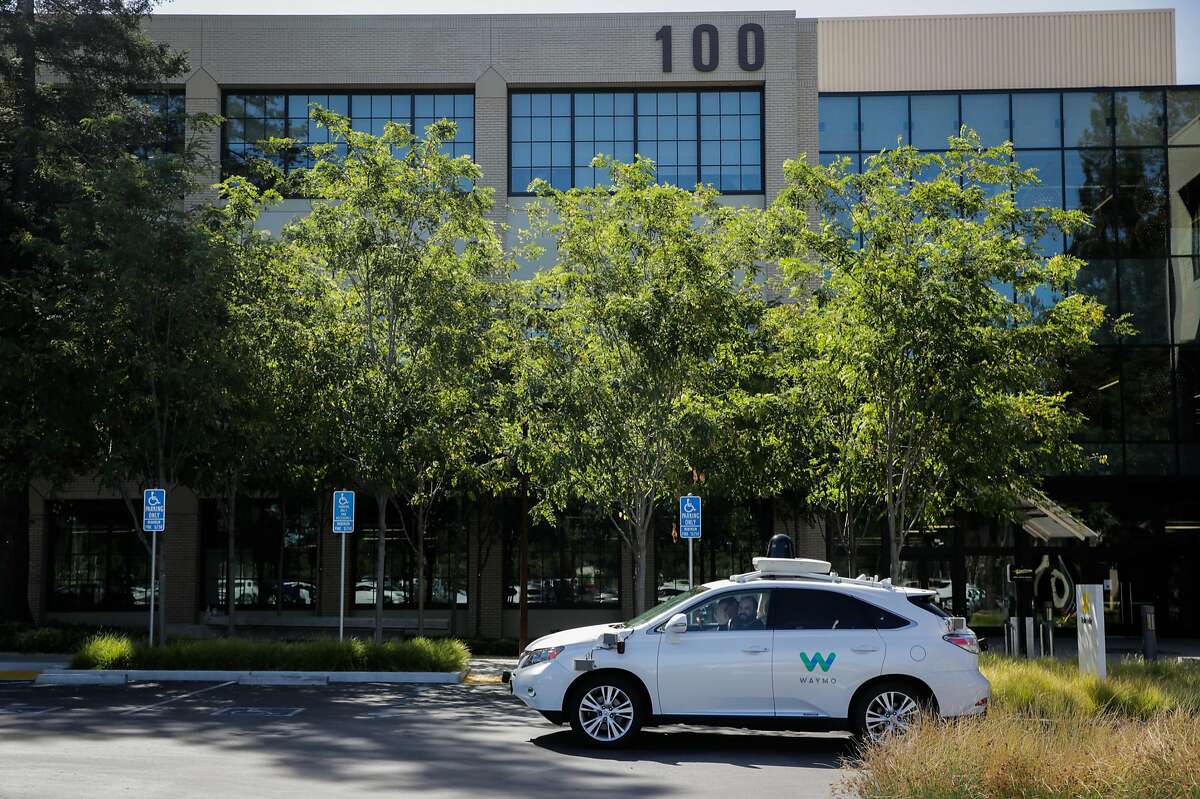 A Waymo car is seen in the parking lot outside of its offices in Mountain View, Calif., on Monday, July 10, 2017.