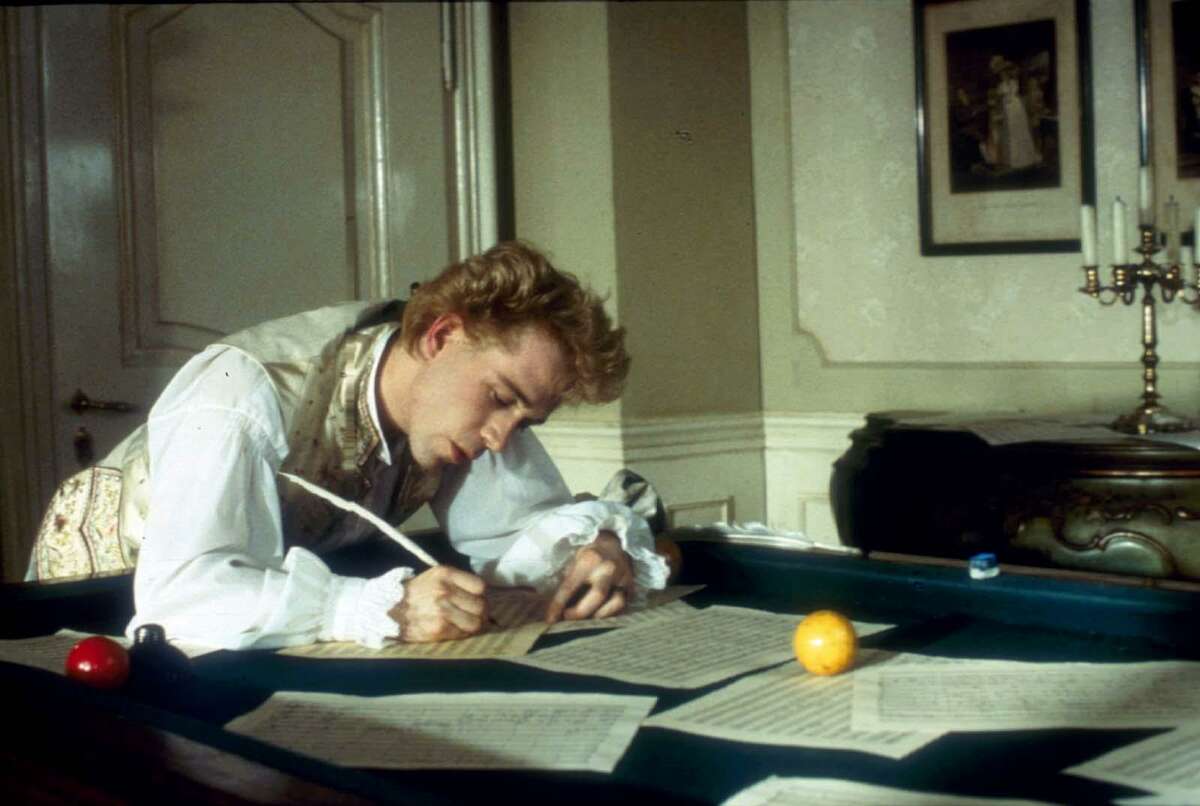 Mozart (Tom Hulce) composes music over a billiard table in the 'Amadeus Director’s Cut.'