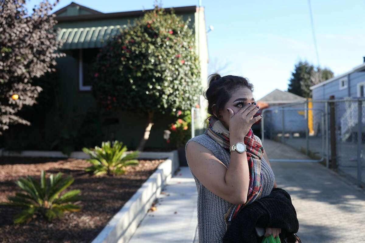 Maria Rodriguez, neighborhood resident, wipes a tear from her eye as she talks about concerns for her son after a 3 year old boy was shot in the neighborhood the day before on Tuesday, October 30, 2018 in Oakland, California.