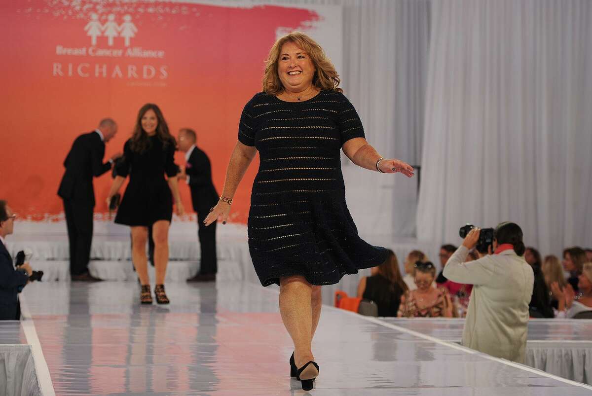 Breast cancer survivor Elyn Braun-O'Connor, of New York, NY, struts her stuff on the catwalk during the Breast Cancer Alliance Annual Luncheon and Fashion Show at the Hyatt Regency Hotel in Greenwich, Conn. on Tuesday, October 30, 2018.