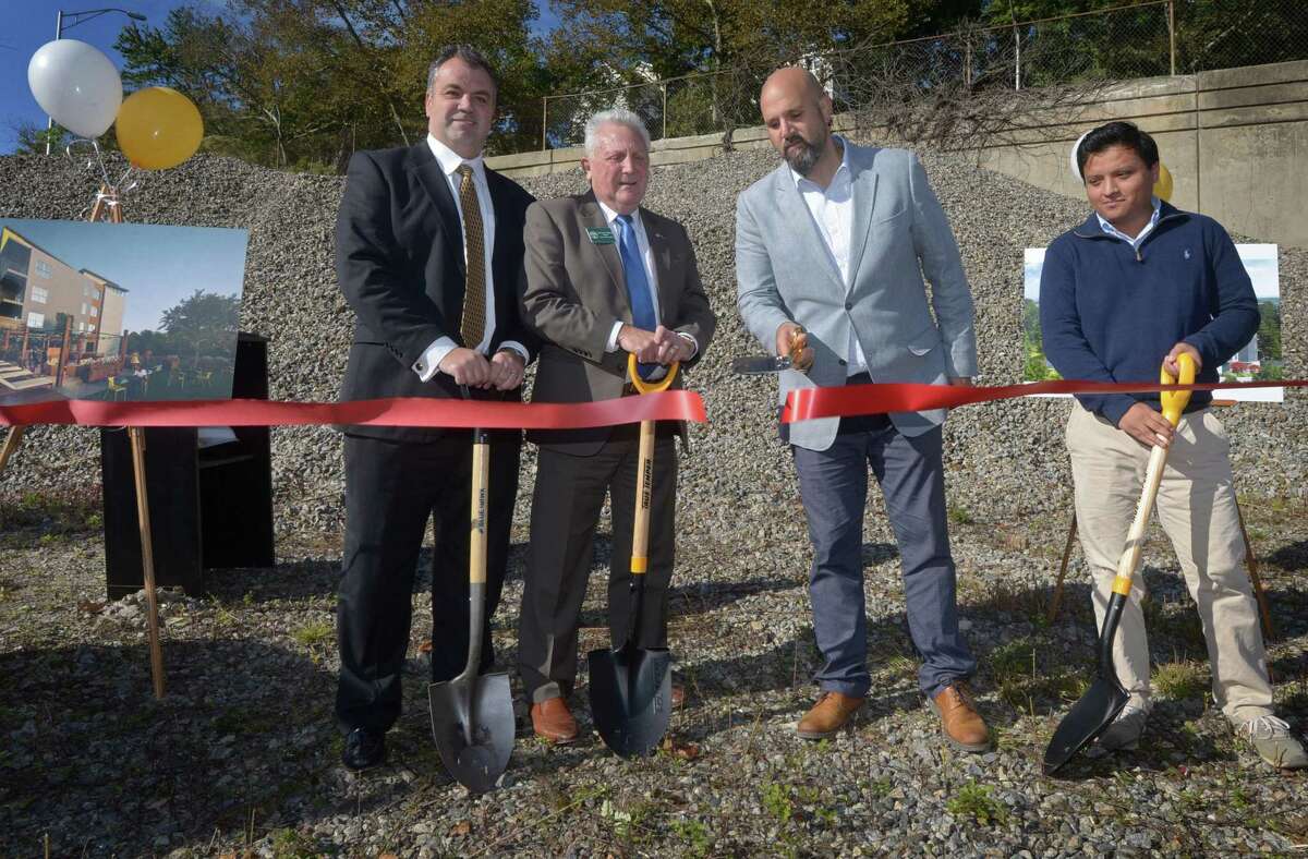 M.F. DiScala CFO Alan Webber, Norwalk Mayor Harry Rilling, Sedona Group President John DiScala and Sig Con Associates Project Miguel Flores cut the ribbon Thursday, October 25, 2018, for the groundbreaking of local developer Michael F. DiScala's new project, SoNo One, a four-story, 40-unit apartment building approved for 1 Bates Court in South Norwalk, Conn. John DiScala announced the formation of committee to help the homeless during the groundbreaking ceremony. The approved apartment development looks to help improve Whistleville, an area near the South Norwalk Train Station.