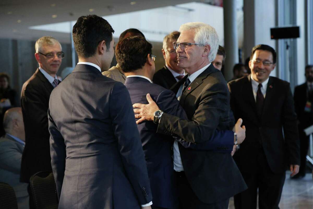 Jim Carr, Canada's international trade minister, greets ministers before speaking during the Ottawa Ministerial for World Trade Organization Reform in Ottawa, Ontario, Canada, on Thursday, Oct. 25, 2018. The trade gathering comes at a precarious moment for the WTO, which is struggling to contain an escalating trade war between the U.S. and China, the world's two largest economies. Photographer: David Kawai/Bloomberg