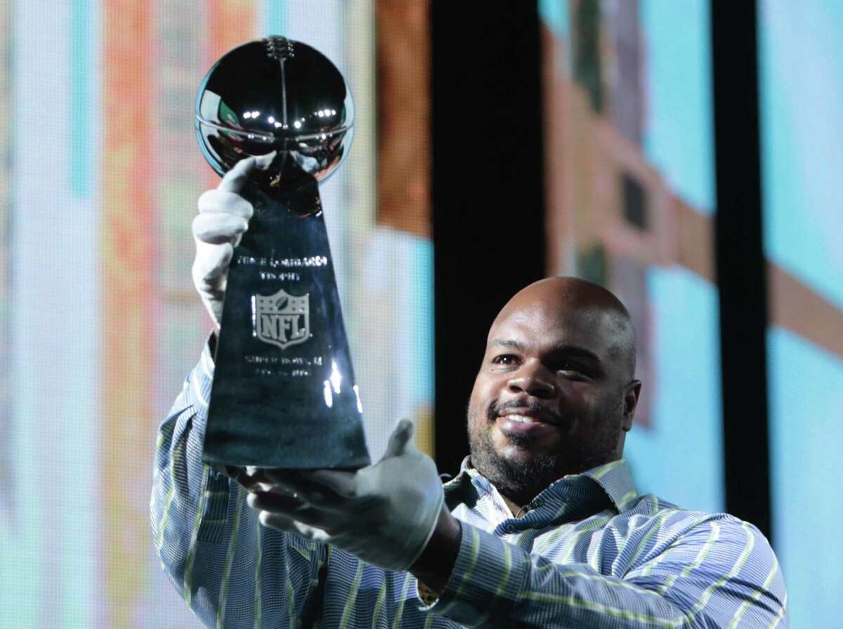 Houston Texans nose tackle Vince Wilfork with a Patriots Super Bowl trophy.
