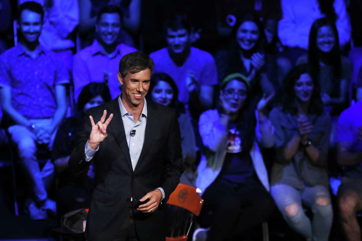 U.S. Senate candidate Rep. Beto O'Rourke (D-TX) flashes the University of Houston hand sign during a town hall meeting hosted by MSNBC at the Cullen Performance Center at the university October 30, 2018 in Houston, Texas. With one week until Election Day, O'Rourke is running for Senate against incumbent Sen. Ted Cruz.