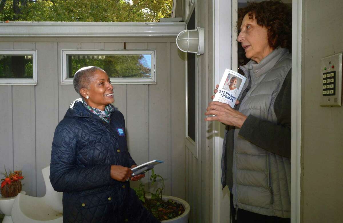 Democratic candidate for the State Representative District 143th seat, Stephanie Thomas, canvasses at the home of Martha Castillo Thursday, October 25, 2018, on Murray Street in Norwalk, Conn.
