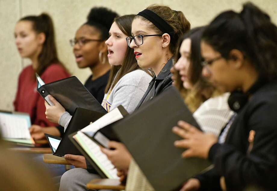 the university chorale rehearses for an upcoming concert