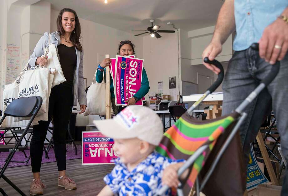 Board of Supervisors District 6 candidate Sonja Trauss prepares to leave her campaign headquarters with volunteer Marielou Pascua, second left, her 10-month-old son Anton and her husband, Ethan Ashley, to canvas with Assemblyman David Chiu and fellow District 6 Supervisor candidate Christine Johnson in San Francisco, Calif. Saturday, Sept. 22, 2018. in San Francisco, Calif. Photo: Jessica Christian / The Chronicle