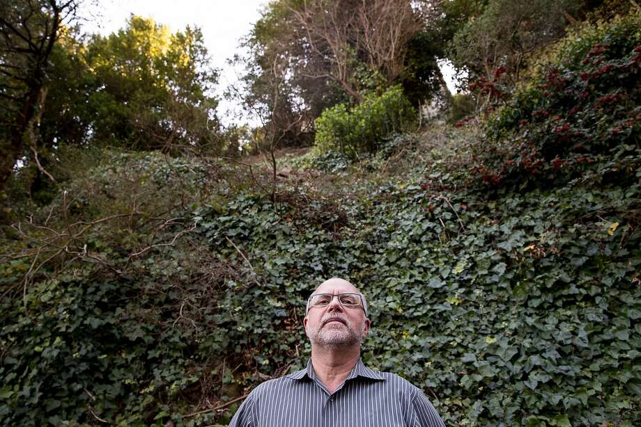 Sausalito homeowner David Holub poses for a portrait beneath his hillside property in Sausalito, Calif. Friday, Oct. 26, 2018. Members of the YIMBY party assisted Holub in getting plans approved for a second structure beneath his existing home on this site. Photo: Jessica Christian / The Chronicle