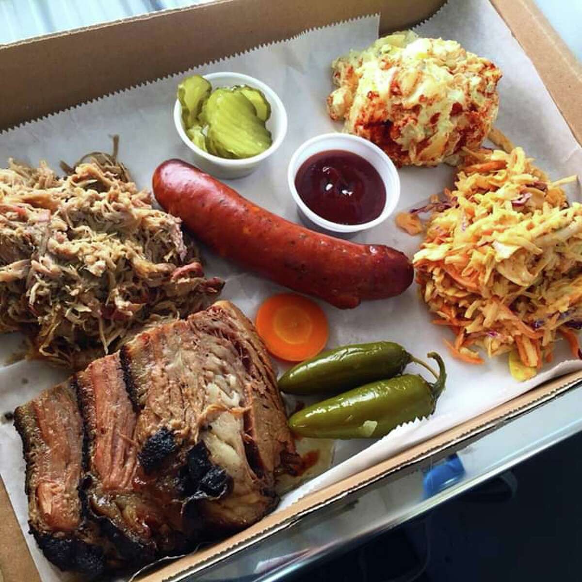 Duncan describes his BBQ as "Central Texas Style, Low & Slow 14 hour Smoked Briskets" and offers sandwiches, tacos, nachos, and baked potatoes, with more items like beef ribs, Smoked turkey and boudin planned for the Katy location's menu.