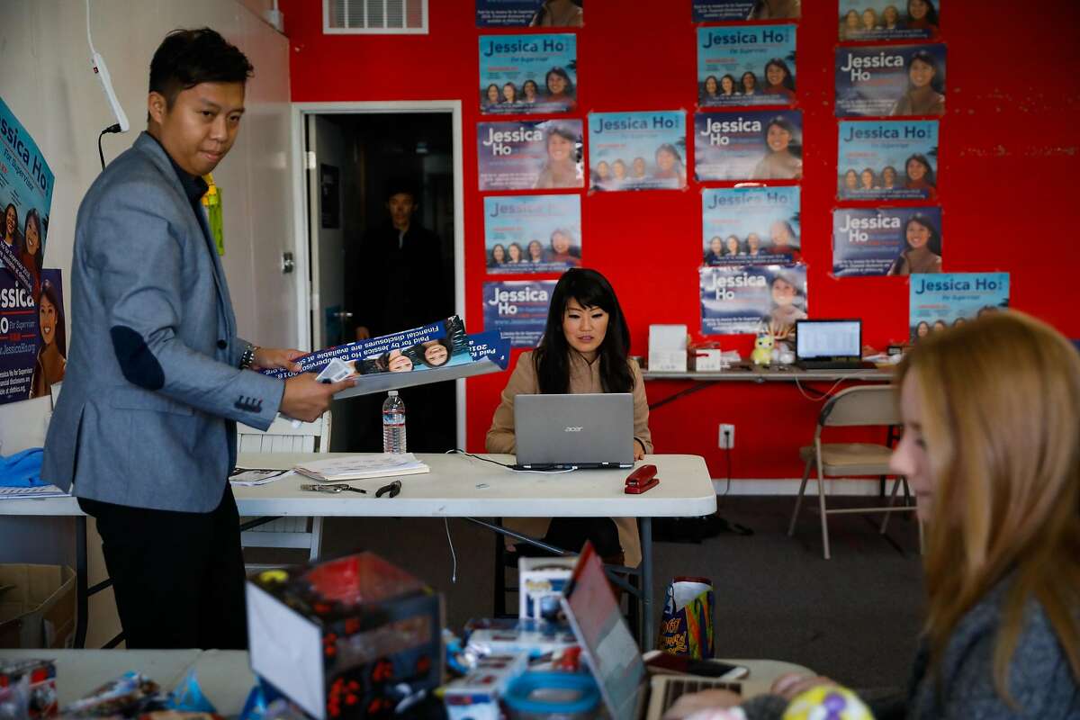 Jessica Ho (center), who is running for District 4 Supervisor checks her computer at her campaign headquarters as she make phone calls to donors in San Francisco, California, on Wednesday, Oct. 31, 2018.